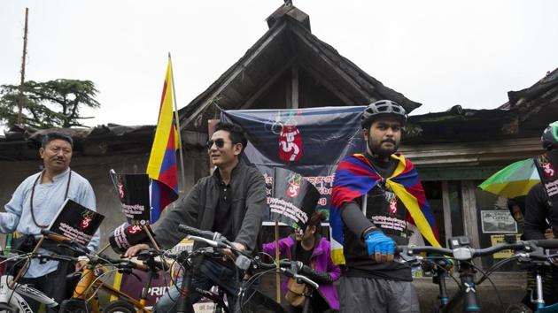Exile Tibetans get ready for a cycle rally to commemorate the 2008 uprising in Tibet, ten years after the inauguration of the Beijing Olympics, in Dharmsala. Beginning in March 2008, hundreds of Tibetans had taken to streets in the Tibetan capital Lhasa protesting Chinese rule. (Ashwini Bhatia / AP) Exile Tibetans get ready for a cycle rally to commemorate the 2008 uprising in Tibet, ten years after the inauguration of the Beijing Olympics, in Dharmsala. Beginning in March 2008, hundreds of Tibetans had taken to streets in the Tibetan capital Lhasa protesting Chinese rule. (Ashwini Bhatia / AP)
