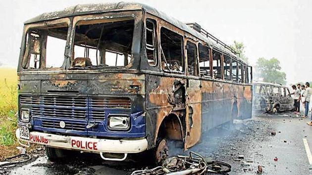 Vehicles were torched by protesters at Behbal Kalan village in Faridkot in October 2015 following a stir over incidents of sacrilege of Guru Granth Sahib.(HT File)