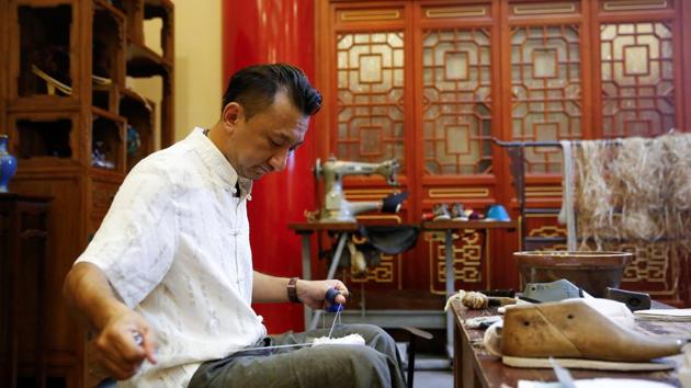 Among its satisfied customers, Neiliansheng counts politicians and celebrities, from Mao Zedong and Deng Xiaoping to Jackie Chan. In pre-industrial times, mothers at home would collect odd bits of cloth around the year, eventually splicing and trimming them into shape as soles for the family’s new shoes as the Chinese New Year drew closer. (Thomas Peter / REUTERS) Among its satisfied customers, Neiliansheng counts politicians and celebrities, from Mao Zedong and Deng Xiaoping to Jackie Chan. In pre-industrial times, mothers at home would collect odd bits of cloth around the year, eventually splicing and trimming them into shape as soles for the family’s new shoes as the Chinese New Year drew closer. (Thomas Peter / REUTERS)
