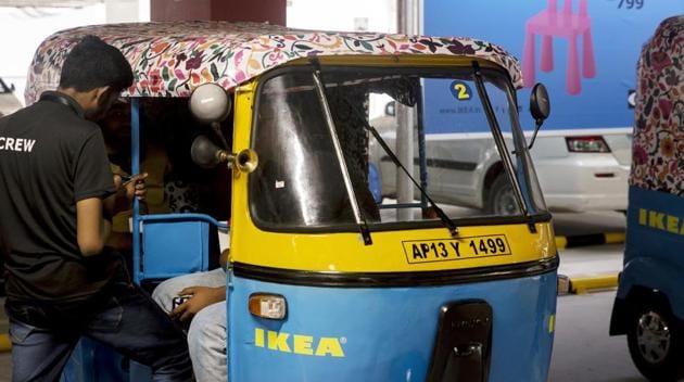 A worker stands next to an Ikea branded auto-rickshaw during the launch of the company's store in Hitech City on the outskirts of Hyderabad, India, on Wednesday, Aug. 8, 2018.(Udit Kulshrestha/Bloomberg)