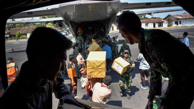 Indonesian soldiers unload relief aid for earthquake victims from a plane at an airbase in Mataram, Lombok. The Indonesian Red Cross says it’s focusing relief efforts on an estimated 20,000 people in remote areas in the north of the island where aid still has not reached. Spokesman Arifin Hadi said people need clean water and tarpaulins most of all. (Ahmad Subaidi / Antara Foto / REUTERS) Indonesian soldiers unload relief aid for earthquake victims from a plane at an airbase in Mataram, Lombok. The Indonesian Red Cross says it’s focusing relief efforts on an estimated 20,000 people in remote areas in the north of the island where aid still has not reached. Spokesman Arifin Hadi said people need clean water and tarpaulins most of all. (Ahmad Subaidi / Antara Foto / REUTERS)