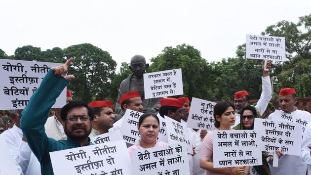 Political party leaders display placards and raise slogans during a protest over the recent incidents of Deoria and Muzaffarpur shelter homes, during Monsoon Session at the Parliament in New Delhi, on Monday.(Vipin Kumar/HT File photo)