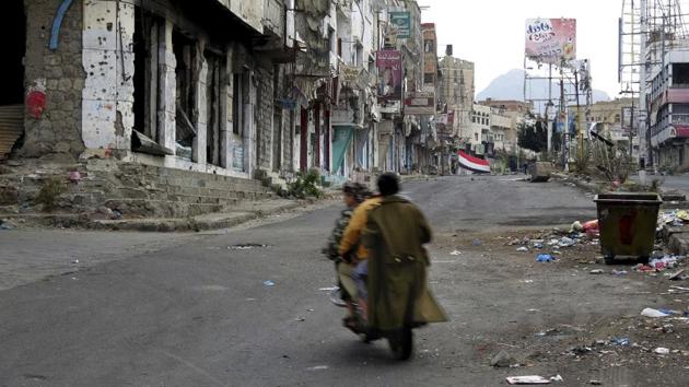 Men ride through streets wrecked by fighting in Taiz, Yemen in February 2018. These compromises and alliances have allowed al-Qaida militants to survive to fight another day. Key participants in the pacts said the US was aware of the arrangements and held off on drone strikes. The deals uncovered by the AP reflect the contradictory interests of the two wars being waged simultaneously in this corner of the Arabian Peninsula. (AP) Men ride through streets wrecked by fighting in Taiz, Yemen in February 2018. These compromises and alliances have allowed al-Qaida militants to survive to fight another day. Key participants in the pacts said the US was aware of the arrangements and held off on drone strikes. The deals uncovered by the AP reflect the contradictory interests of the two wars being waged simultaneously in this corner of the Arabian Peninsula. (AP)