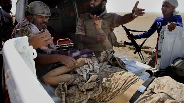 Coalition-backed fighters help a wounded man during an advance on Mocha in January 2017. Coalition-backed militias actively recruit al-Qaida militants, or those who were recently members, because they’re considered exceptional fighters, the AP found. These forces are comprised of a dizzying mix of militias, factions, tribal warlords and tribes with very local interests. And AQAP militants are intertwined with many of them. (AP) Coalition-backed fighters help a wounded man during an advance on Mocha in January 2017. Coalition-backed militias actively recruit al-Qaida militants, or those who were recently members, because they’re considered exceptional fighters, the AP found. These forces are comprised of a dizzying mix of militias, factions, tribal warlords and tribes with very local interests. And AQAP militants are intertwined with many of them. (AP)