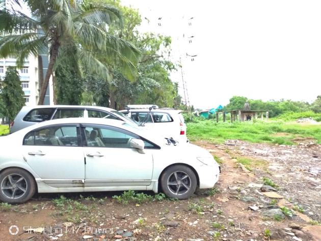 Cars parked at a patch in Gorai where mangroves existed. (HT photo) Cars parked at a patch in Gorai where mangroves existed. (HT photo)