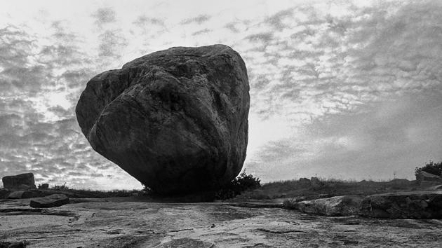 A large boulder sits amid the ruins in Hampi. The Hasselblad palette of these exquisite black and white photographs is made up of visual octaves through the many subtle shades that lie between black and white, stillness and movement. (Rajib De) A large boulder sits amid the ruins in Hampi. The Hasselblad palette of these exquisite black and white photographs is made up of visual octaves through the many subtle shades that lie between black and white, stillness and movement. (Rajib De)