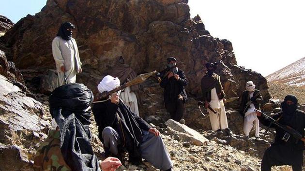 In this photograph taken January 23, 2010, Taliban fighters pose during a patrol in Ghazni province.(AFP Photo)