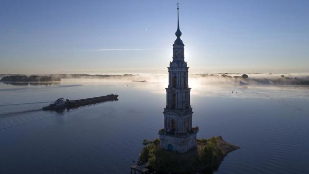 A cargo ship floats past the famous Kalyazin Bell Tower, part of the submerged monastery of St. Nicholas, in the town of Kalyazin located on the Volga River, north-east of Moscow, Russia. (Dmitry Lovetsky / AP) A cargo ship floats past the famous Kalyazin Bell Tower, part of the submerged monastery of St. Nicholas, in the town of Kalyazin located on the Volga River, north-east of Moscow, Russia. (Dmitry Lovetsky / AP)