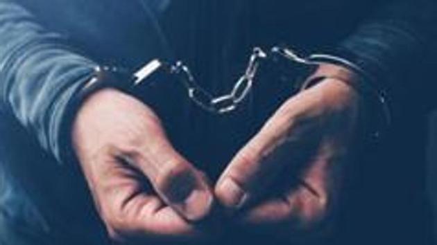 Arrested computer hacker and cyber criminal with handcuffs, close up of hands (Getty Images/iStockphoto) Arrested computer hacker and cyber criminal with handcuffs, close up of hands (Getty Images/iStockphoto)