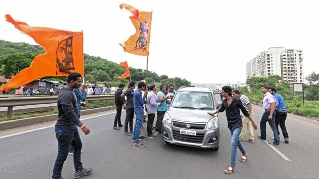 Protesters took law into their own hands near Chandani Chowk area on Pune-Bengaluru highway as they jumped in front of cars and other vehicles, threatening them to go back or face ‘dire consequences’. (Pratham Gokhale/HT Photo) 