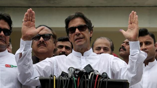 Cricket star-turned-politician Imran Khan, chairman of Pakistan Tehreek-e-Insaf (PTI), speaks after voting in the general election in Islamabad.(REUTERS)