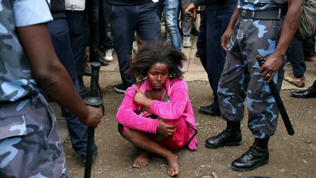 Ethiopian Federal Police officers detain a woman suspected to be carrying explosives during the welcoming ceremony of Jawar Mohammed, US-based Oromo activist and leader of the Oromo Protests, in Addis Ababa, Ethiopia. (Tiksa Negeri / REUTERS) Ethiopian Federal Police officers detain a woman suspected to be carrying explosives during the welcoming ceremony of Jawar Mohammed, US-based Oromo activist and leader of the Oromo Protests, in Addis Ababa, Ethiopia. (Tiksa Negeri / REUTERS)