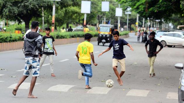 But not everything was ominous as this group of boys were seen enjoying their holiday on Tarapore road. (Shankar Narayan/HT Photo) 