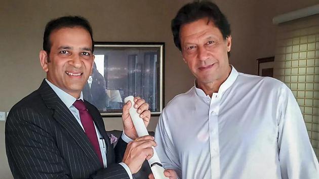 Indian high commissioner to Pakistan Ajay Bisaria presents a cricket bat signed by the Indian cricket team to Pakistan's PM designate Imran Khan in Islamabad. (PTI Photo) Indian high commissioner to Pakistan Ajay Bisaria presents a cricket bat signed by the Indian cricket team to Pakistan's PM designate Imran Khan in Islamabad. (PTI Photo)