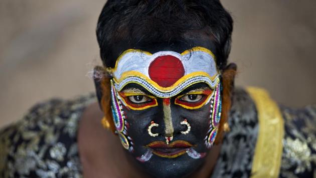 An artist waits to perform during a ‘Bonalu’ procession in Hyderabad, Telangana on August 06, 2018. Bonalu is a month long Hindu folk festival of the Telangana region dedicated to Kali, the Hindu goddess of destruction. (Mahesh Kumar A / AP) An artist waits to perform during a ‘Bonalu’ procession in Hyderabad, Telangana on August 06, 2018. Bonalu is a month long Hindu folk festival of the Telangana region dedicated to Kali, the Hindu goddess of destruction. (Mahesh Kumar A / AP)