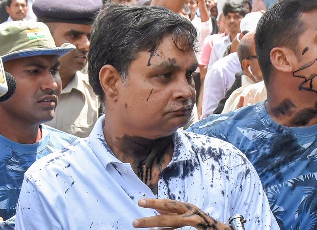 Brajesh Thakur, main accused in the Muzaffarpur shelter home case , after a woman allegedly threw ink on his face while he was being taken to a special POCSO court, in Muzaffarpur, August 8 (PTI) Brajesh Thakur, main accused in the Muzaffarpur shelter home case , after a woman allegedly threw ink on his face while he was being taken to a special POCSO court, in Muzaffarpur, August 8 (PTI)