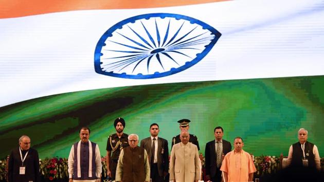 President Ram Nath Kovind, Uttar Pradesh governor Ram Naik, chief minister Yogi Adityanath and other dignitaries stand up for National Anthem during the One District, One Product Summit at Indira Gandhi Pratishan in Lucknow, Uttar Pradesh. (Subhankar Chakraborty / HT Photo) President Ram Nath Kovind, Uttar Pradesh governor Ram Naik, chief minister Yogi Adityanath and other dignitaries stand up for National Anthem during the One District, One Product Summit at Indira Gandhi Pratishan in Lucknow, Uttar Pradesh. (Subhankar Chakraborty / HT Photo)
