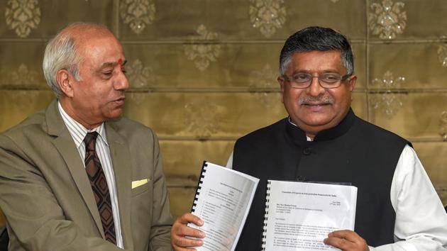 Union Law Minister Ravi Shankar Prasad accepts a report on 'Data Protection Framework' from Justice BN Srikrishna, in New Delhi on Friday, July 27, 2018.(Kamal Singh/PTI) Union Law Minister Ravi Shankar Prasad accepts a report on 'Data Protection Framework' from Justice BN Srikrishna, in New Delhi on Friday, July 27, 2018.(Kamal Singh/PTI)