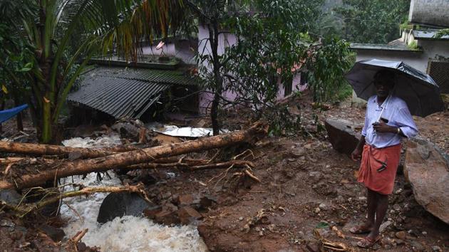 A tree uprooted in Kerala's Kannur district after heavy rains with flash floods, in Kerala, (PTI)
