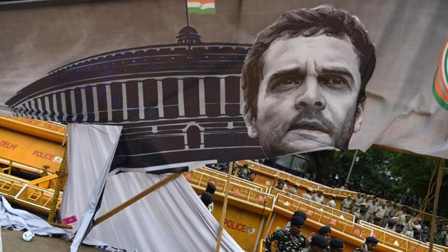 Policemen stand near a partially torn banner bearing a picture of Congress president Rahul Gandhi after a protest by members of the National Students Union of India (NSUI), against an increase in lawlessness and unemployment in the county under the ruling alliance led by Prime Minister Narendra Modi in New Delhi on August 8, 2018. (Sajjad Hussain / AFP) Policemen stand near a partially torn banner bearing a picture of Congress president Rahul Gandhi after a protest by members of the National Students Union of India (NSUI), against an increase in lawlessness and unemployment in the county under the ruling alliance led by Prime Minister Narendra Modi in New Delhi on August 8, 2018. (Sajjad Hussain / AFP)