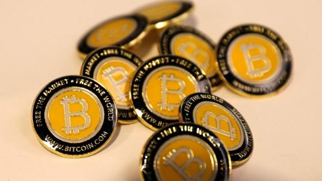 Bitcoin.com buttons are seen displayed on the floor of the Consensus 2018 blockchain technology conference in New York City, New York, US (Reuters File Photo) Bitcoin.com buttons are seen displayed on the floor of the Consensus 2018 blockchain technology conference in New York City, New York, US (Reuters File Photo)