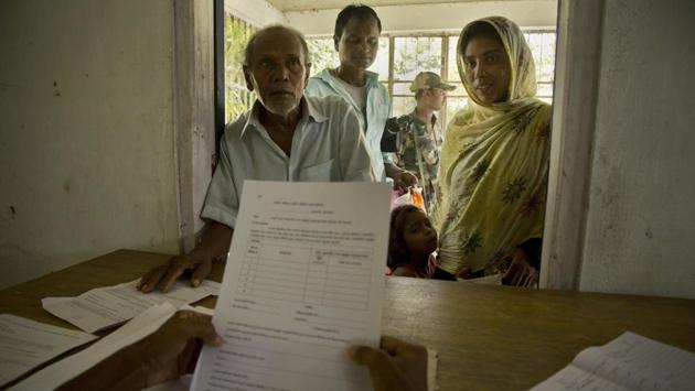 People whose names were left out in the National Register of Citizens (NRC) draft stand to collect forms to file appeals in Mayong. Nearly 4 million people who insist they are Indian must now prove their nationality as the politics of citizenship — overlaid with questions of religion, ethnicity and illegal immigration — swirls in a state where such questions have a long and bloody past. (Anupam Nath / AP)