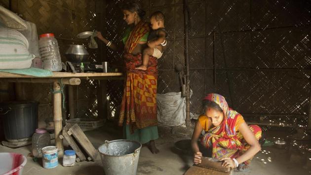 Pratima Namo Das, 22, (R) and her mother-in-law Tara Namo Das, 45, cook inside the family house in Mayong. It’s unclear what will happen to people who are still not listed as citizens after appeals. Detention is a strong possibility for some, but Bangladesh insists it will not accept mass expulsions. Activists worry many could be left in limbo for years, perhaps decades as stateless wanderers. (Anupam Nath / AP)