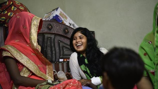 The bride, Sheetal Kumari (C) shares a moment with a relative at her residence at Nizampur, a village of about a hundred households flanked by fields. The family had been on tenterhooks leading up to the wedding. Since April, when Sanjay Jatav won the baraat battle, the family had received a bouquet of threats and ominous signals from the Thakurs. (Anushree Fadnavis / HT Photo) The bride, Sheetal Kumari (C) shares a moment with a relative at her residence at Nizampur, a village of about a hundred households flanked by fields. The family had been on tenterhooks leading up to the wedding. Since April, when Sanjay Jatav won the baraat battle, the family had received a bouquet of threats and ominous signals from the Thakurs. (Anushree Fadnavis / HT Photo)