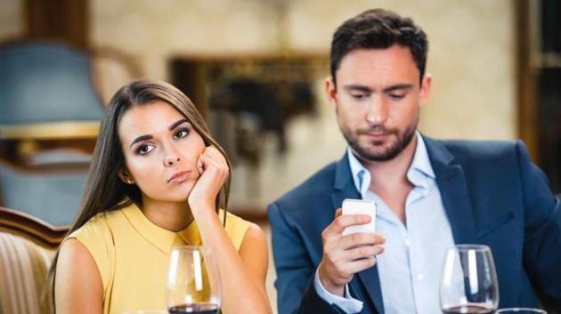 Social media may be affecting your relationship as it prevents you from staying in the moment and enjoying time out with friends.(Shutterstock)