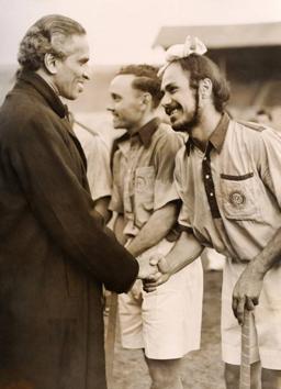 Indian Hign Commissioner Krishna Menon (L) congratulates Balbir Singh and the Indian hockey team after their gold medal winning performance at the Olympics in London.(Getty Images)