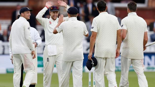 England's Joe Root (2L) celebrates with teammates after winning the second Test cricket match between England and India at Lord's Cricket Ground in London.(AFP)