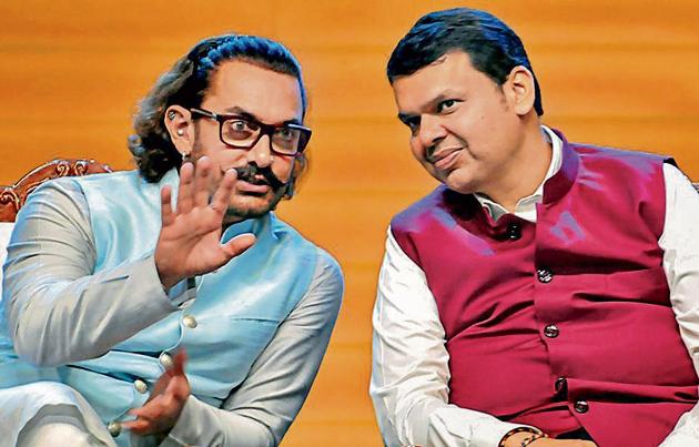Aamir Khan (left), Bollywood actor and founder of the Paani Foundation, and Devendra Fadnavis, chief minister, during the Water Cup award distribution ceremony at Balewadi Sports Complex on Sunday. (PTI) Aamir Khan (left), Bollywood actor and founder of the Paani Foundation, and Devendra Fadnavis, chief minister, during the Water Cup award distribution ceremony at Balewadi Sports Complex on Sunday. (PTI)