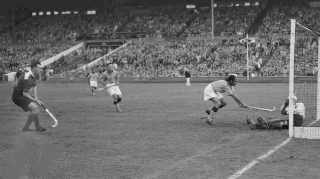 India's centre forward Balbir Singh (2R) tries to score a goal during the men's Olympic Games Hockey match against Great Britain, at Wembley Stadium, London, Aug. 12, 1948. Britain's goalkeeper D.L.S. Brodie saved the attempt and India won the match 4-0.(AP)