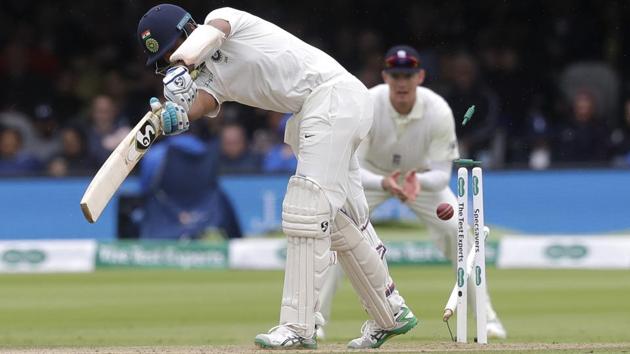 India's Cheteshwar Pujara is bowled by England's Stuart Broad. (AP)