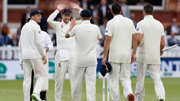 England's Joe Root (2L) celebrates with teammates after winning the second Test cricket match between England and India at Lord's Cricket Ground in London on August 12, 2018. (AFP)