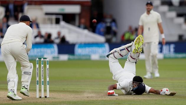 India's Ravichandran Ashwin dives back to his crease as England's Jonny Bairstow attemtpts to take his wicket. (AFP)