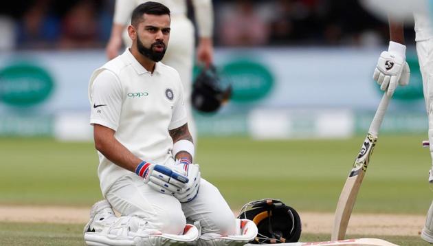 India's Virat Kohli reacts before receiving treatment from medical staff for a back injury during the second Test match against England.(Action Images via Reuters)