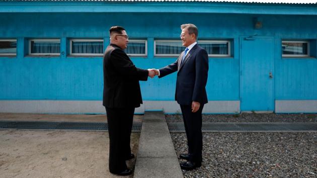 This file photo taken on April 27, 2018 shows North Korea's leader Kim Jong Un (L) shaking hands with South Korea's President Moon Jae-in (R) at the Military Demarcation Line that divides their countries ahead of their summit at the truce village of Panmunjom. (AFP Photo) This file photo taken on April 27, 2018 shows North Korea's leader Kim Jong Un (L) shaking hands with South Korea's President Moon Jae-in (R) at the Military Demarcation Line that divides their countries ahead of their summit at the truce village of Panmunjom. (AFP Photo)