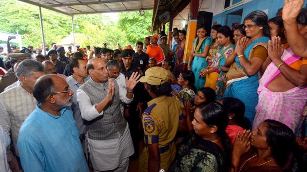 Union home minister Rajnath Singh next to Kerala chief minister Pinarayi Vijayan and minister of state tourism Alphons Kannanthanam (L) during their visit to a makeshift relief camp in Chengamanadu Government Higher Secondary School (HSS) in Ernakulam district of Kochi.(AFP Phot o) Union home minister Rajnath Singh next to Kerala chief minister Pinarayi Vijayan and minister of state tourism Alphons Kannanthanam (L) during their visit to a makeshift relief camp in Chengamanadu Government Higher Secondary School (HSS) in Ernakulam district of Kochi.(AFP Phot o)