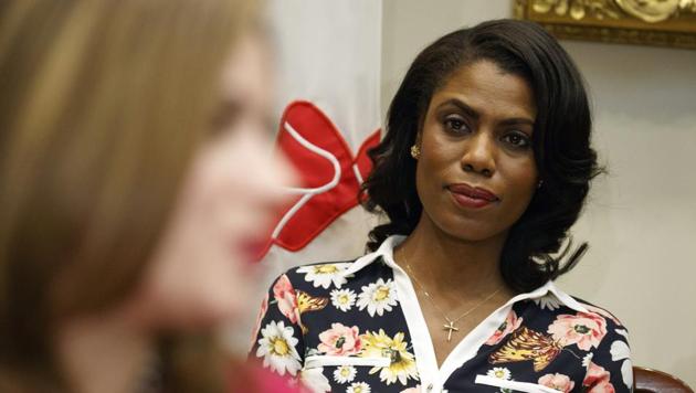 White House chief of staff John Kelly reportedly asked Omarosa Manigault Newman (in flowered shirt) to leave over “serious integrity” issues.(AP File)