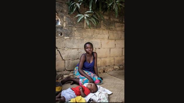 Emma, 13, gave into the advances of a man she met in the market who offered her 200 meticals (three euros) for her virginity. When she fell pregnant, Ema was flabbergasted. “I didn’t know you could get pregnant by making love,” she said, breastfeeding seven-month-old Ismail in the clay yard outside her grandmother’s home. “I can’t go out and play with my friends anymore,” she said. (Gianluigi Guercia / AFP) Emma, 13, gave into the advances of a man she met in the market who offered her 200 meticals (three euros) for her virginity. When she fell pregnant, Ema was flabbergasted. “I didn’t know you could get pregnant by making love,” she said, breastfeeding seven-month-old Ismail in the clay yard outside her grandmother’s home. “I can’t go out and play with my friends anymore,” she said. (Gianluigi Guercia / AFP)