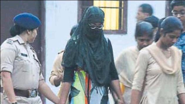 Director of the NGO Aasra Hom Manisha Dayal in police custody, in Patna on Monday. (HT photo) Director of the NGO Aasra Hom Manisha Dayal in police custody, in Patna on Monday. (HT photo)