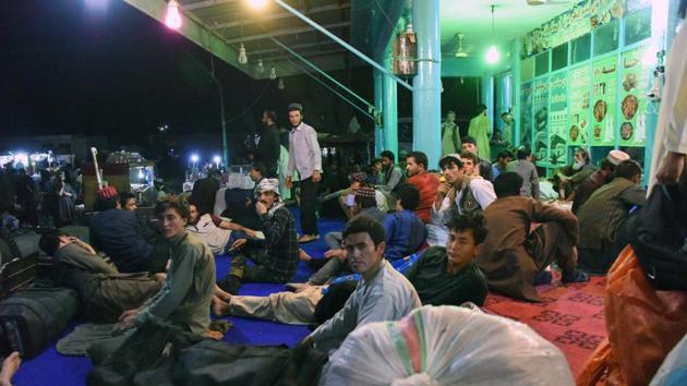 Afghan passengers bound to Kabul wait at a bus station in Kandahar province as the Kabul-Kandahar bus services stopped following a Taliban assault in the city of Ghazni on August 13, 2018 . (AFP Photo) Afghan passengers bound to Kabul wait at a bus station in Kandahar province as the Kabul-Kandahar bus services stopped following a Taliban assault in the city of Ghazni on August 13, 2018 . (AFP Photo)