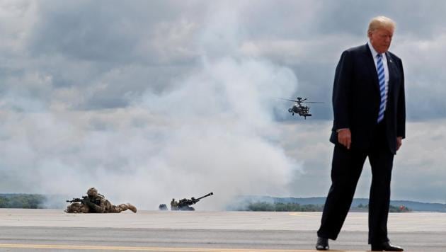 US President Donald Trump observes a demonstration with US Army 10th Mountain Division troops, an attack helicopter and artillery as he visits Fort Drum, New York on August 13. (REUTERS) US President Donald Trump observes a demonstration with US Army 10th Mountain Division troops, an attack helicopter and artillery as he visits Fort Drum, New York on August 13. (REUTERS)