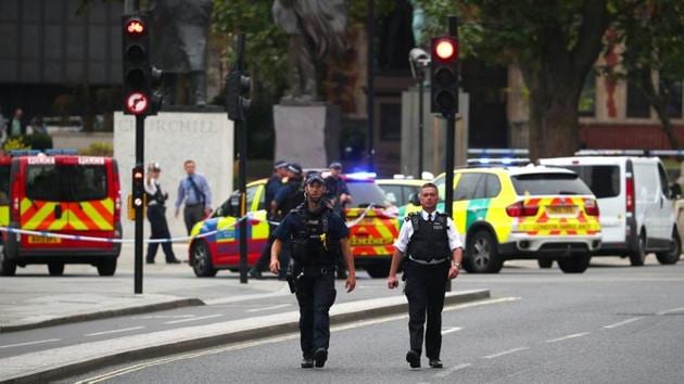 Armed police stand in the street after a car crashed outside the Houses of Parliament in Westminster, London, Britain, on Tuesday. (Reuters photo) Armed police stand in the street after a car crashed outside the Houses of Parliament in Westminster, London, Britain, on Tuesday. (Reuters photo)