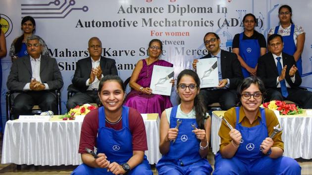 (Second row, from left) PVS Shastry, secretary of MKSSS; ND Patil, vice-chairman, MKSSS; Smita Ghaisas, president, MKSSS; Santosh Iyer, vice-president, customer service and corporate affairs, and YP Kulkarni, GM, customer service and retail training, Mercedes-Benz India, along with students of Cummins engineering college at the campus on Monday. (Sanket Wankhade/HT PHOTO) (Second row, from left) PVS Shastry, secretary of MKSSS; ND Patil, vice-chairman, MKSSS; Smita Ghaisas, president, MKSSS; Santosh Iyer, vice-president, customer service and corporate affairs, and YP Kulkarni, GM, customer service and retail training, Mercedes-Benz India, along with students of Cummins engineering college at the campus on Monday. (Sanket Wankhade/HT PHOTO)