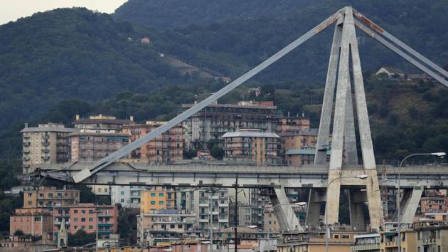 The Morandi motorway bridge is seen from a distance after a section collapsed earlier in Genoa on August 14, 2018.(AFP Photo)