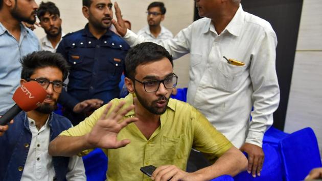 Umar Khalid speaks to the media moments after he was shot at, during an event at the Constitution Club in New Delhi on Monday.(PTI photo)