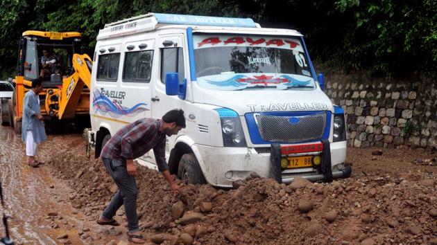 As per reports, two dozen houses and structures suffered damaged due to rains, flash floods and landslides in Jammu, Kathua, Poonch, Rajouri, Udhampur and Reasi districts and scores of vehicles have been damaged in Jammu city.(Nitin Kanotra / HT Photo)