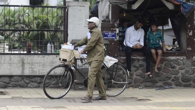 A postman on duty after Maharashtra Bandh. An officiating postmaster in a village of the Bhadrak district of Odisha was suspended Tuesday after villagers complained that thousands of mails, some dating back to 2004, were lying in the post office undelivered, an official said.(Representative Image/HT Photo)